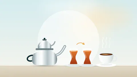 Çaydanlık, biri yüzeyinde ince zar olan iki ince belli çay bardağı ve dumanı tüten bir fincan kahve
